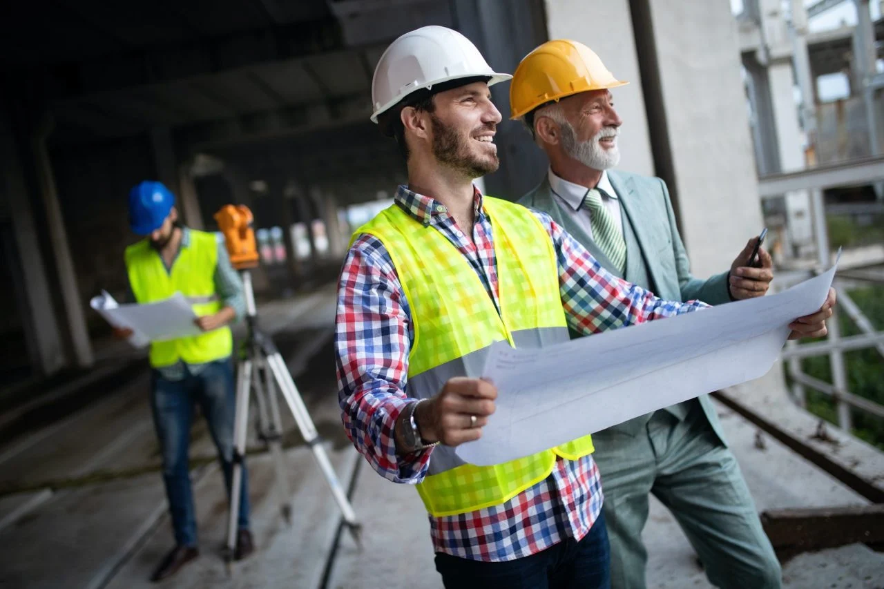 Construction-engineer-with-foreman-worker-checking-construction-site